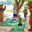 Yogi Bear and friends playing mini golf at a Jellystone campground